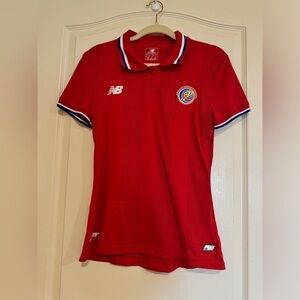 New Balance red Federacion Costarricense De Futbol polo​​​​​​​